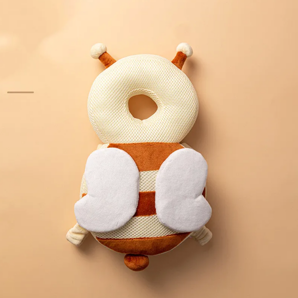 Plush toy shaped like a bee on a beige background